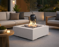 25-inch tempered glass wind guard on a 32-inch concrete fire pit centered around a teak seating area on a stone patio. 