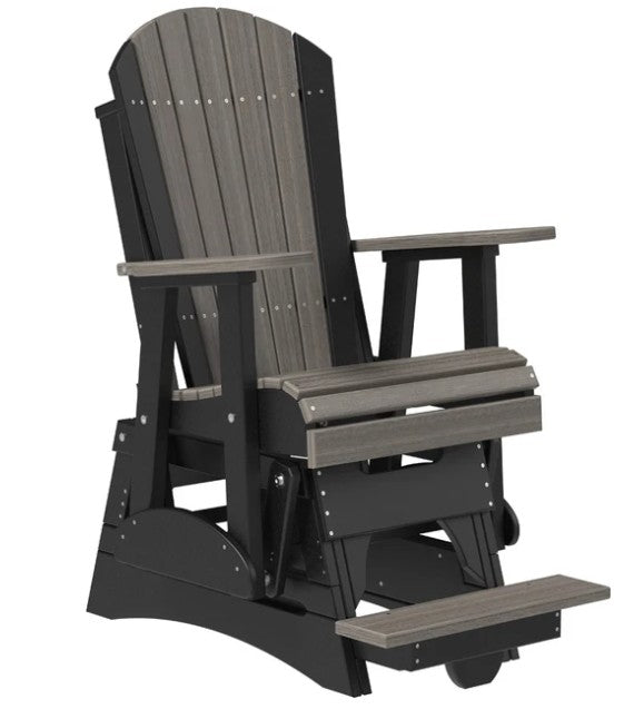 A dark gray and black outdoor rocking Adirondack chair with a footrest, shown on a solid white background.