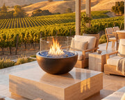 HPC 30-inch glass wind guard on a 30 inch  fire bowl placed on an elevated deck wth view of a vineyard.  