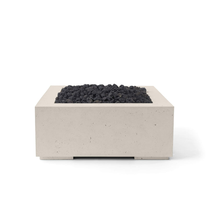 Alea 40-inch clay concrete fire pit with black lava rocks on a white background. 