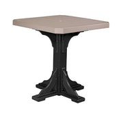 Square table with beige top and black base on a white background