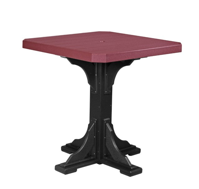 Square table with red top and black base on a white background