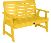 Yellow bench with a visible brand logo on a white background