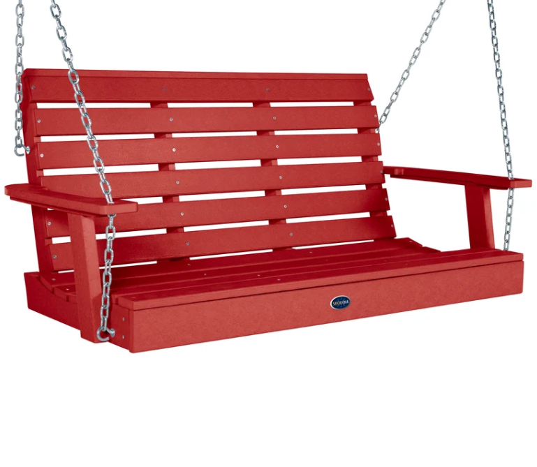 A red slatted porch swing bench suspended by silver metal chains, shown on a plain white background. A small oval logo badge is visible on the front lower rail.