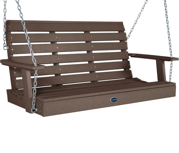 A brown slatted porch swing bench with silver hanging chains, shown on a plain white background. A small oval brand badge on the front reads POLYWOOD.