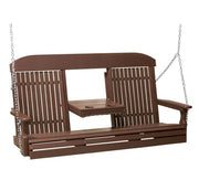 A brown slatted porch swing bench with a small attached side table and silver hanging chains, shown on a plain white background.