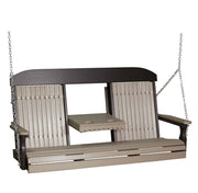 A two-person outdoor porch swing bench with a small attached side table, featuring a dark brown frame and light beige slatted panels, suspended by metal chains.