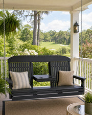 A 5' classic porch swing on a covered porch with views of lush gardens and a golf course.  