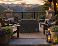 Alea 40-inch-tall vinyl fire pit cover that is covering a fire pit on a stone patio in the mountains.  The fire pit is centered amongst Adirondack chairs, pillows and blankets surrounded by potted plants, flowers and views of the mountains.  