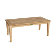 Angled view of teak rectangular coffee table on a white background.  