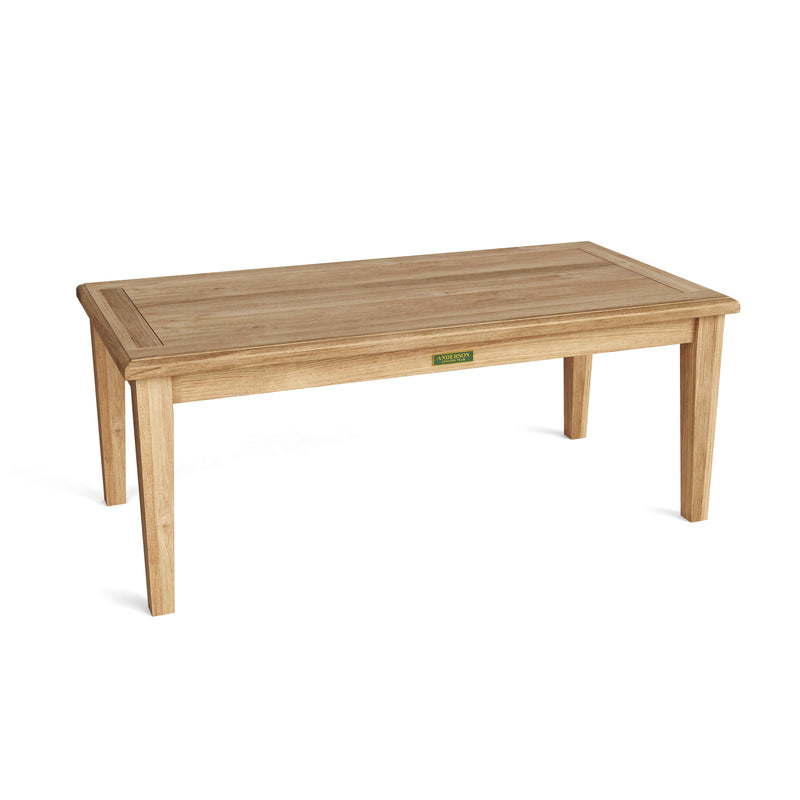 Angled view of teak rectangular coffee table on a white background.  