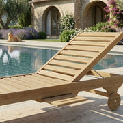 Close-up of Anderson Teak Capri Sun Lounger showing slatted Grade-A teak surface, adjustable backrest support, slide-out side tray, and built-in wheels