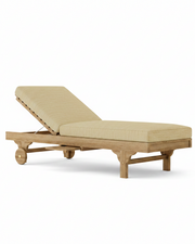 Capri teak lounger with dupion sand cushion on a white background.