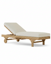 Capri teak lounger with linen canvas cushion on a white background.  