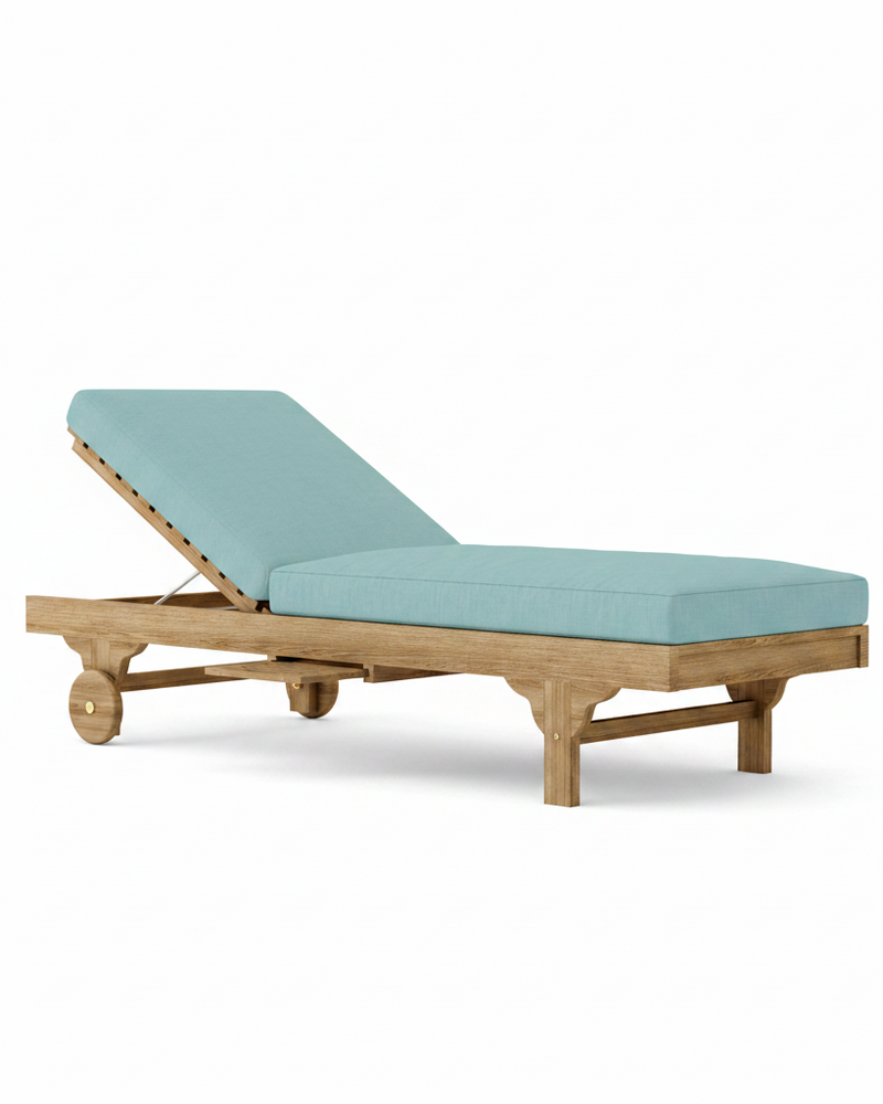 Capri teak lounger with mineral blue cushion on white background. 