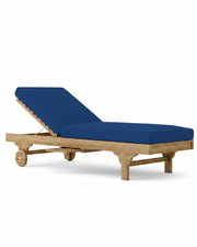 Capri teak lounger with pacific blue cushion on white background.
