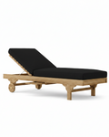 Capri teak lounger with black cushion on white background.  