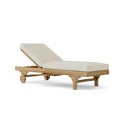 Capri teak lounger with natural cushion on a white background.  