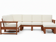 A modern outdoor sectional sofa set with cream-colored cushions and a warm brown wooden frame, including a three-seat sofa, a two-seat armchair, and a matching ottoman, shown on a white background.