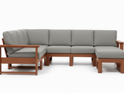 A modular outdoor sectional sofa with light gray textured cushions and a warm brown wooden frame, shown against a plain white background.
