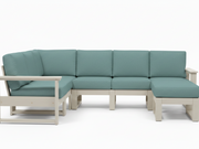 A modern outdoor sectional sofa with light sage green cushions and a light beige frame, shown against a plain white background.