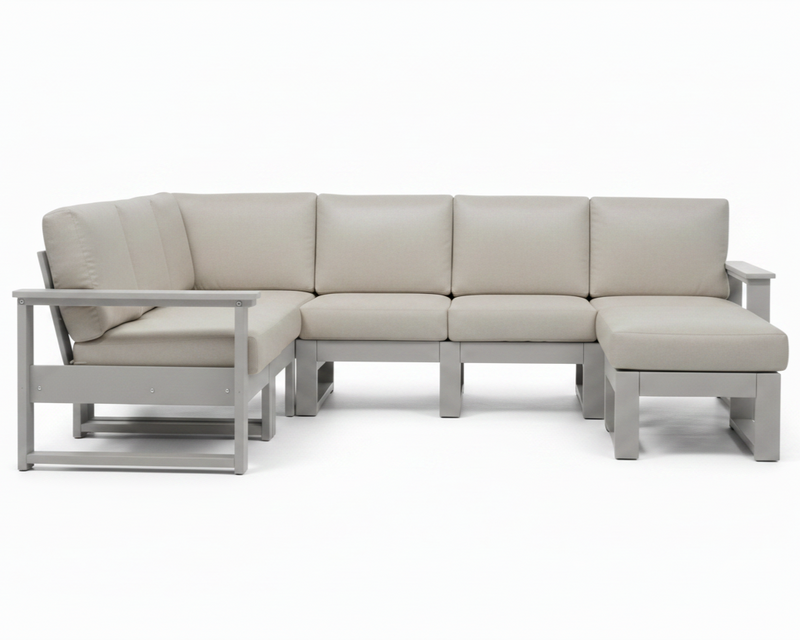 A modern outdoor sectional sofa with light beige cushions and a light gray frame, shown against a plain white background.