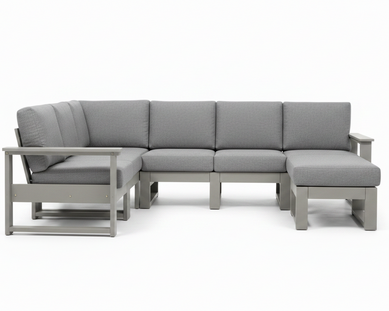 A modern outdoor sectional sofa with a left-facing chaise lounge, featuring light gray textured cushions and a light gray frame, shown against a plain white background.
