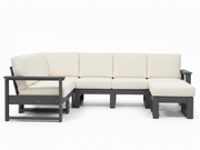 A modern outdoor sectional sofa with cream-colored cushions and a dark gray frame, including a chaise lounge on the left and a right-facing ottoman, shown on a white background.