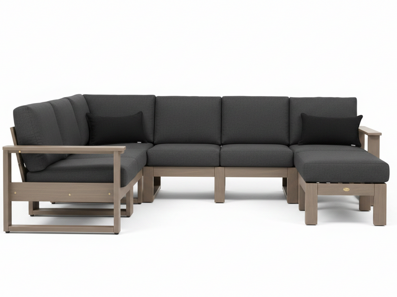 A modern outdoor sectional sofa with dark gray cushions and a light brown frame, shown on a clean white background. The set includes a chaise lounge on the left, a center three-seater section, and a right-facing chaise ottoman.