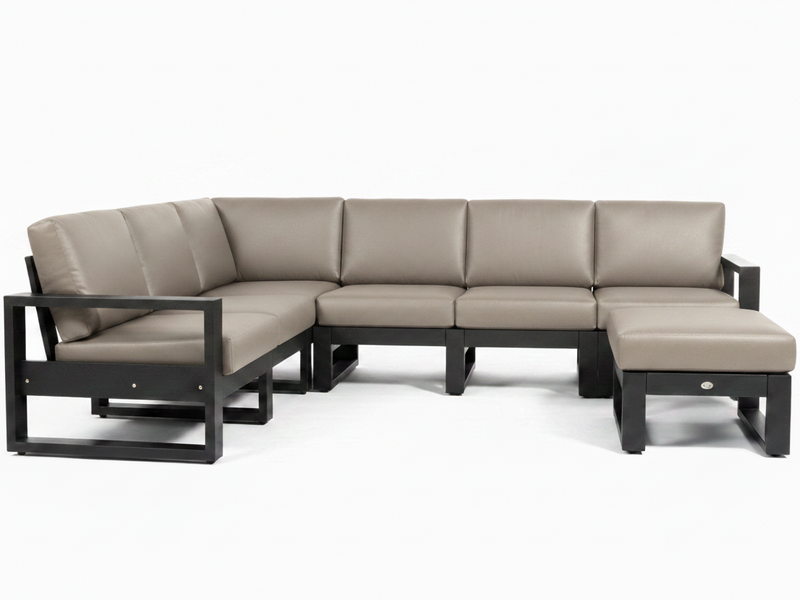 A modern outdoor sectional sofa set with a left-facing chaise lounge and a matching ottoman, upholstered in light taupe leather with a black frame, shown against a plain white background.