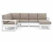 A modern outdoor sectional sofa with a left-facing chaise lounge, featuring light taupe-beige cushions on a white frame, shown against a solid white background.
