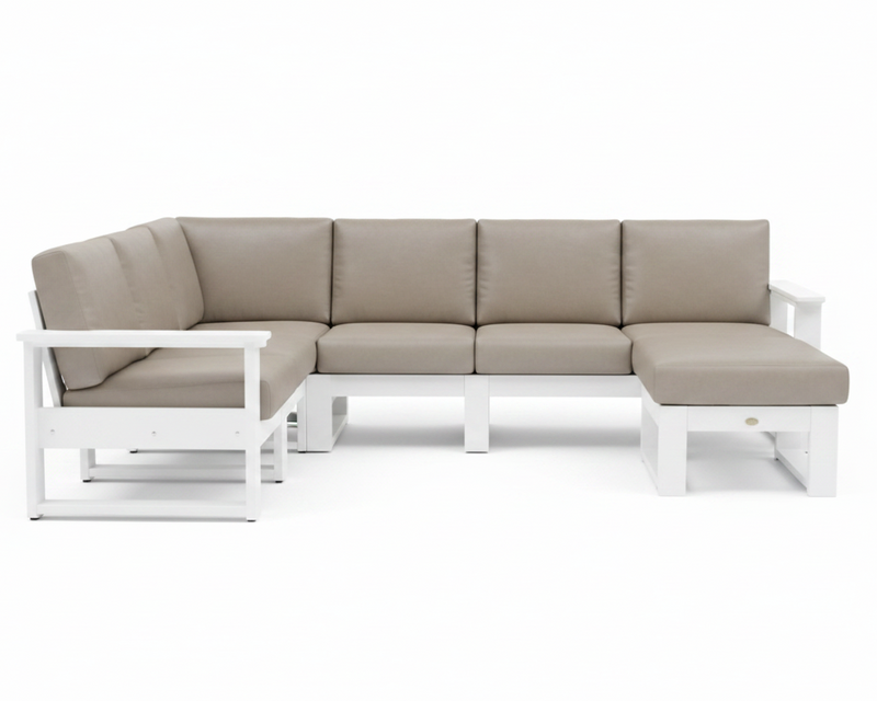 A modern outdoor sectional sofa with a left-facing chaise lounge, featuring light taupe-beige cushions on a white frame, shown against a solid white background.