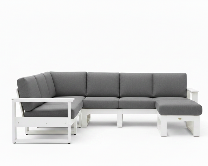 A modern outdoor sectional sofa with a white frame and dark gray cushions, shown against a plain white background.