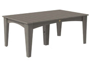 A rectangular outdoor dining table in a weathered gray finish, featuring a slatted top and four tapered legs, shown against a plain white background.