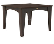 A square dining table with a dark brown finish, featuring four tapered legs, an arched apron, and a small round brass pull on the front.