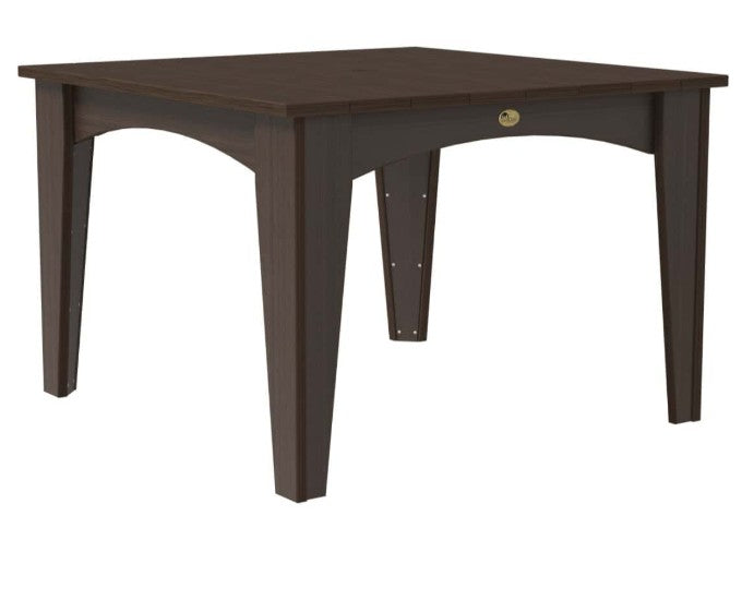 A square dining table with a dark brown finish, featuring four tapered legs, an arched apron, and a small round brass pull on the front.