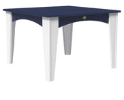 A square outdoor dining table with a navy blue top and apron, supported by four white legs, shown against a plain white background.