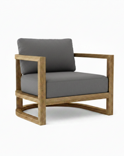 Junus teak armchair with cast charcoal cushion on white background.  