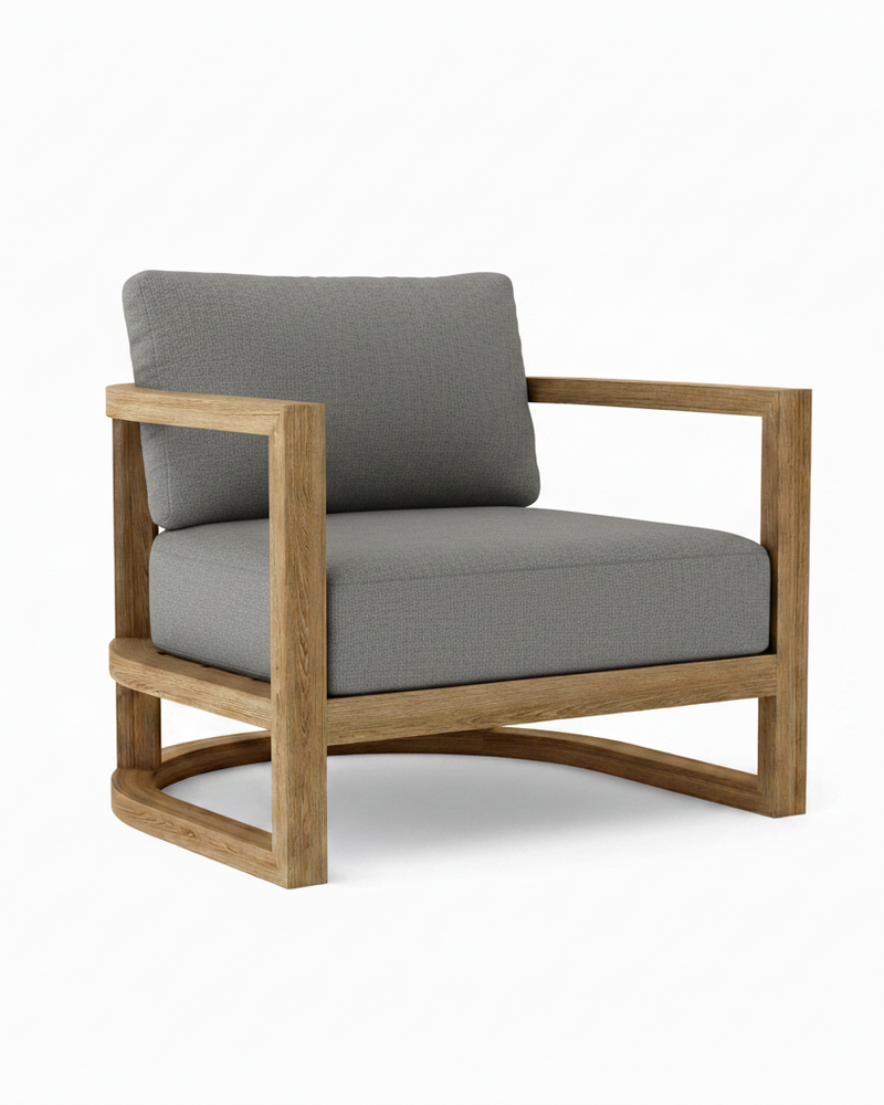 Junus teak armchair with cast slate cushion on white background.  