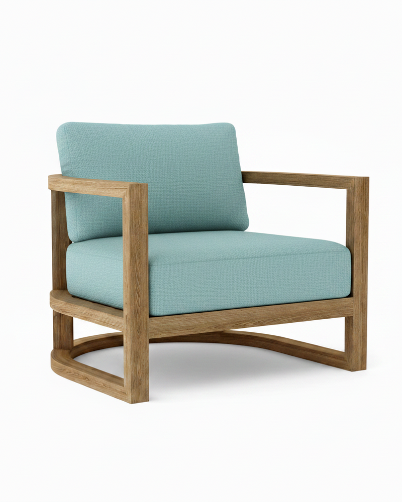 Junus teak armchair with mineral blue cushion on white background.  