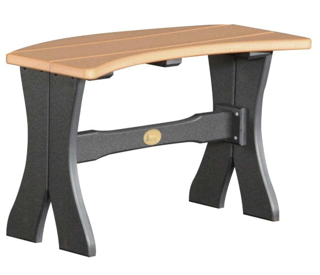 A curved outdoor bench with a light natural wood seat and a dark gray composite frame with a horizontal support beam and a small gold brand plaque.