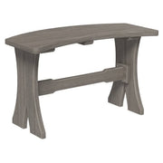 A curved bench with a weathered gray finish, featuring a thick seat, curved legs, and a central support beam, shown against a plain white background.