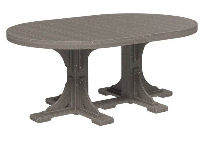 An oval outdoor dining table with a weathered gray wood-look top and a matching trestle-style pedestal base, shown on a plain white background.