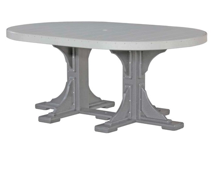An oval outdoor dining table with a light gray composite-look top and a darker gray trestle-style base, shown on a plain white background.