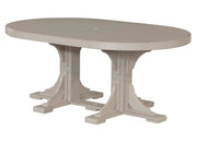 An oval dining table with a distressed light beige finish, featuring a solid top and a sturdy trestle-style pedestal base, shown against a plain white background.