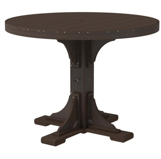 A dark brown round outdoor dining table with a pedestal trestle base and decorative metal rivets around the tabletop edge, shown on a plain white background.