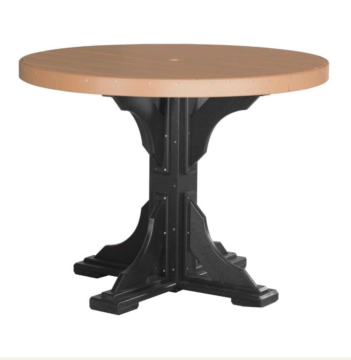 A round outdoor dining table with a light brown composite wood top and a black pedestal base, shown against a plain white background.