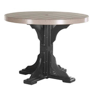 A round outdoor dining table with a light taupe slatted top and a black style pedestal base, shown on a plain white background.