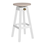 A white bar stool with a round, light beige seat and a small round brass logo medallion on the front.