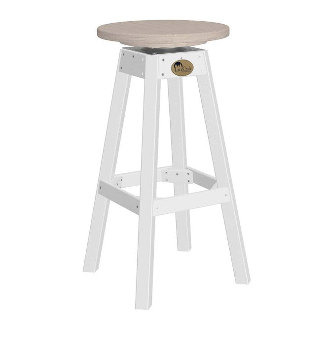 A white bar stool with a round, light beige seat and a small round brass logo medallion on the front.